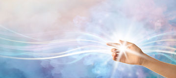 Female hand with shining energy on color background Banner for design.jpg