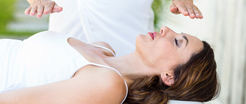 Woman enjoy a Reiki session