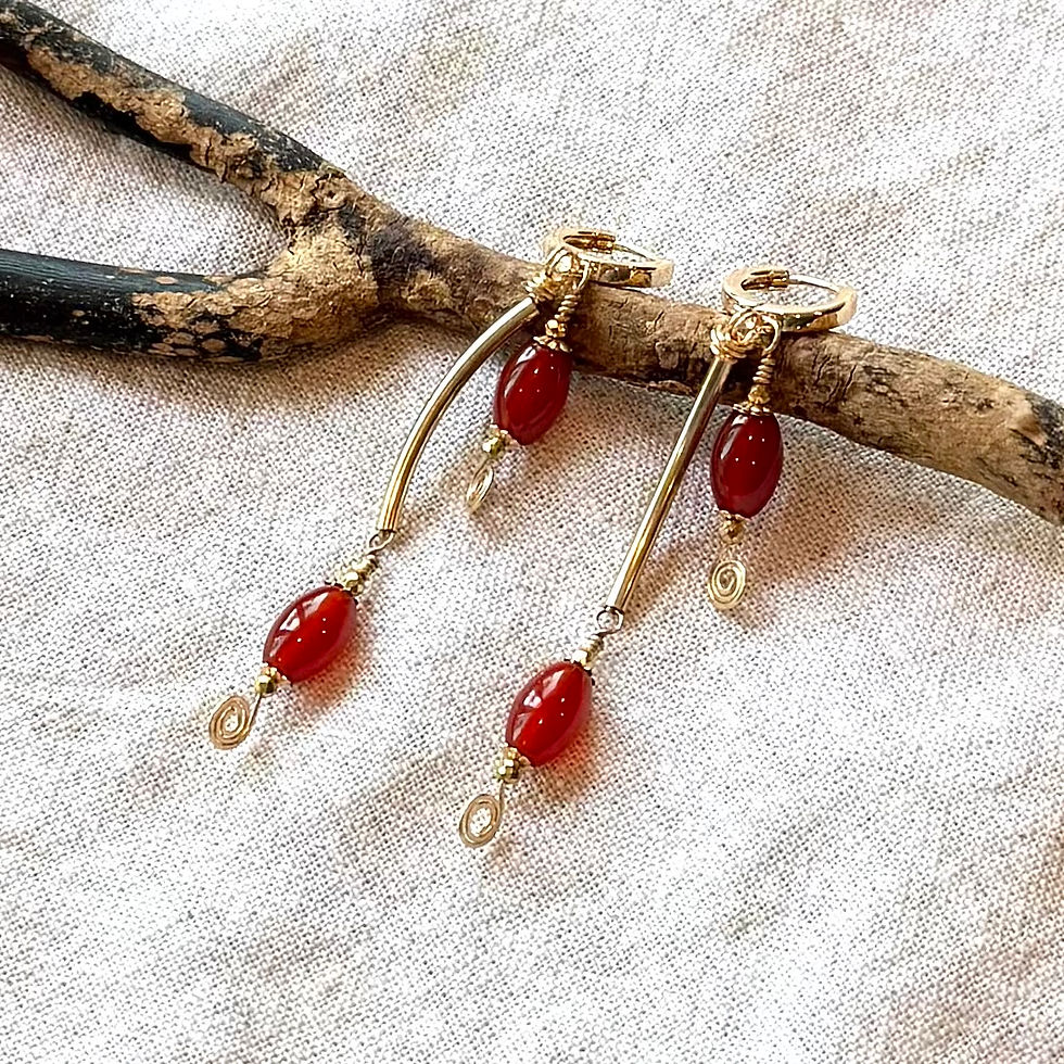 Sienna Red Carnelian Gold Earrings on branch for detail shot.