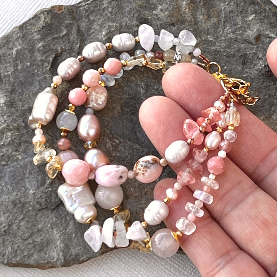 Artisan Pink Peruvian Opal and Pearl Gemstone Bracelet showing the gold-filled adjustment chain and signature gold tag.