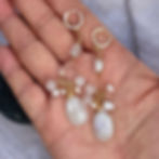 Moonstone & Pearl Gold Earring on hand showing details.