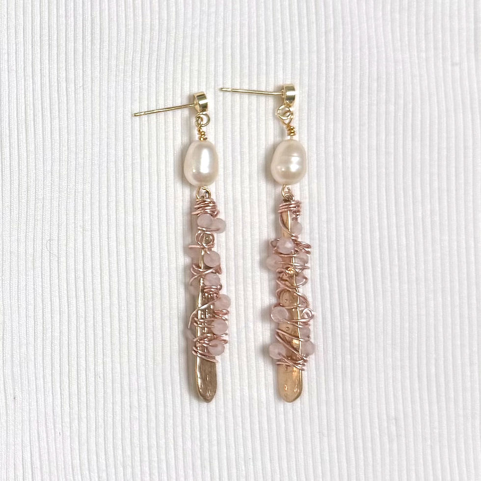 Pearl and Rose Quartz Drop Earring on white cloth.