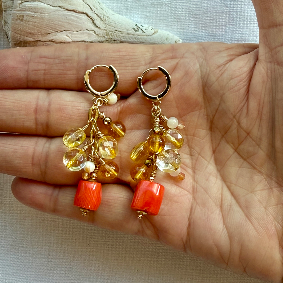 Coral and Citrine Trailing Stone Earring on palm of hand