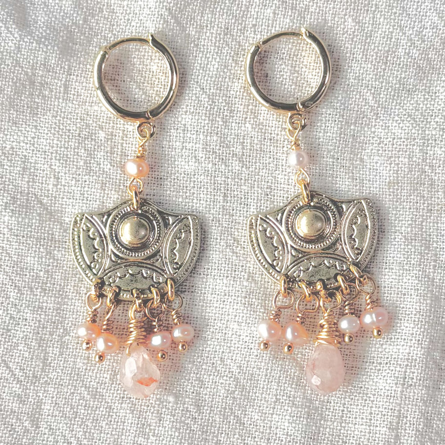Aztec Demi-Lune Pearl Drop Earrings on linen cloth.