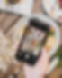 Taking a picture of Cafe Nate menu with a phone