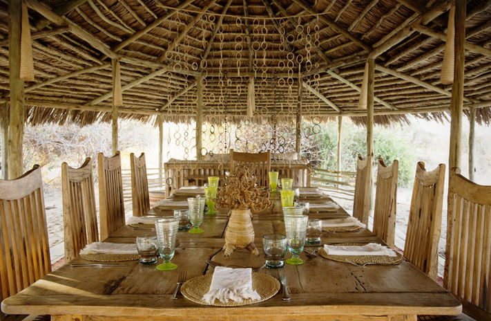 Dining area at Kigelia Ruaha Camp overlooking the Ruaha River and acacia woodland.