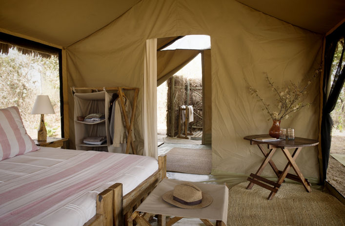 Kigelia Ruaha Camp tented suite surrounded by baobab trees in Ruaha National Park, Tanzania.