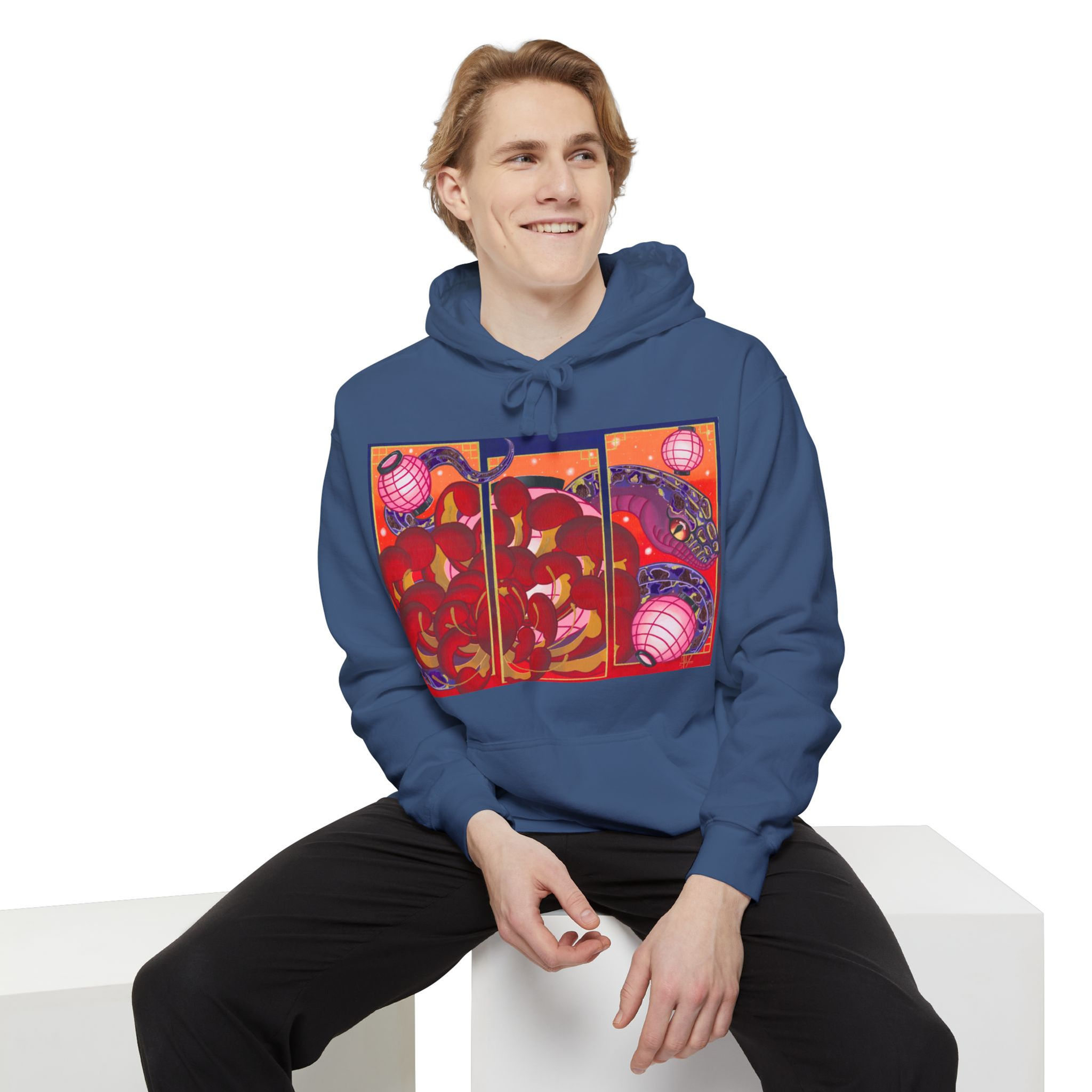 Smiling man wearing a blue Dragon Lantern Hoodie
