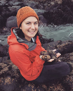 Allie holding up a beautiful limpet in Las Cruces, Chile.