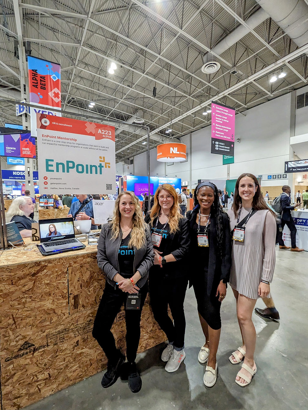 Julia and Chantal in the Collision Conference hall standing with two women