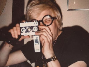 Andy Warhol with Polaroid Camera