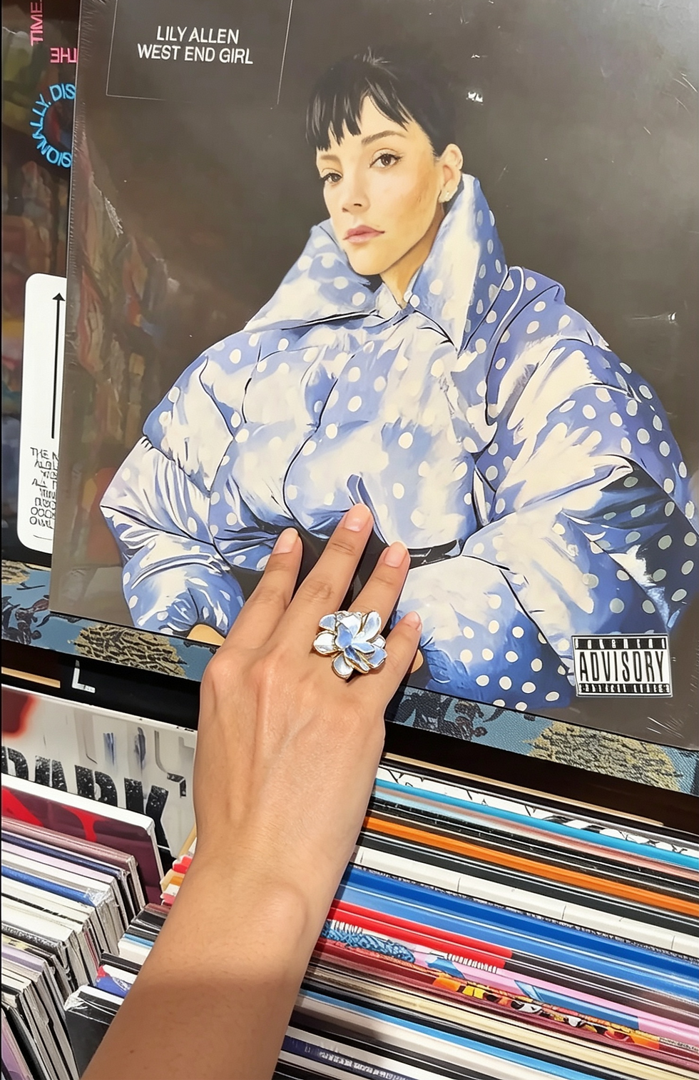 Model wearing Annasach The Arwen ring, front-facing view showing layered petal construction in periwinkle blue enamel