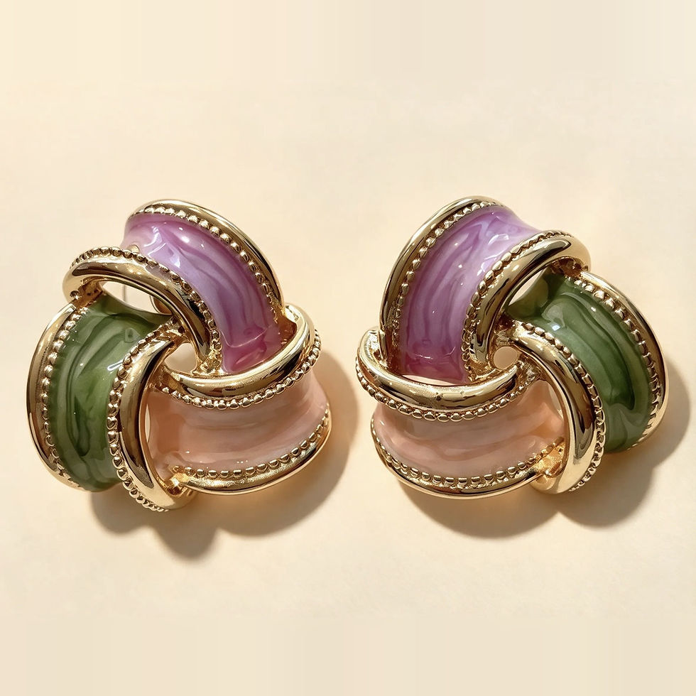 Pair of enamel knot earrings with lilac, sage green and blush bands woven together and edged in gold milgrain