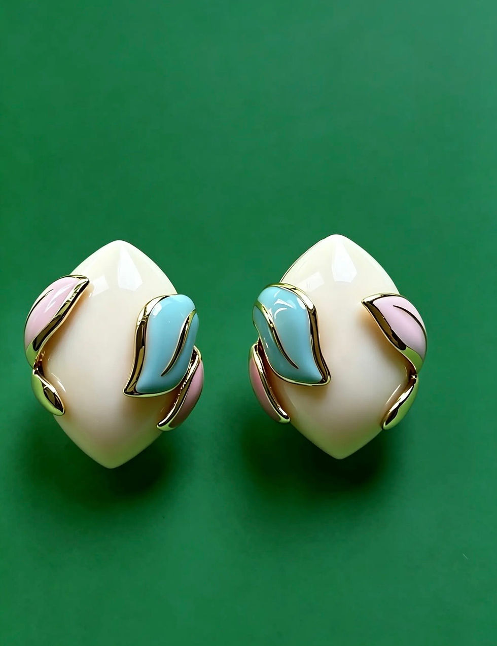 Pair of The Amara Cream, Mint and Blush earrings with sculptural cream enamel, pastel leaf detailing and gold-plated accents.