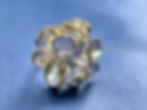 Annasach The Arwen ring, front-facing view showing layered petal construction in periwinkl