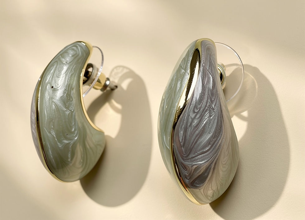 Annasach The Maaya drop earrings, sage green and charcoal marbled enamel elongated dome with gold seam, push back post faste