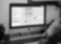 Man creating email automations in Klaviyo software in an office setting