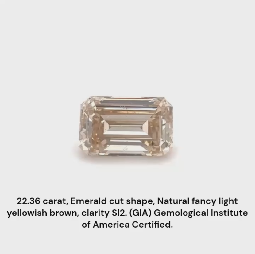 22.36 carat natural fancy light yellowish brown emerald cut shape