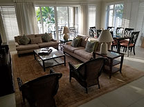 Beachcomber Grand Cayman before image of living room Patricia Moon Design.jpg