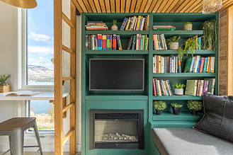 A library of books in a tiny home