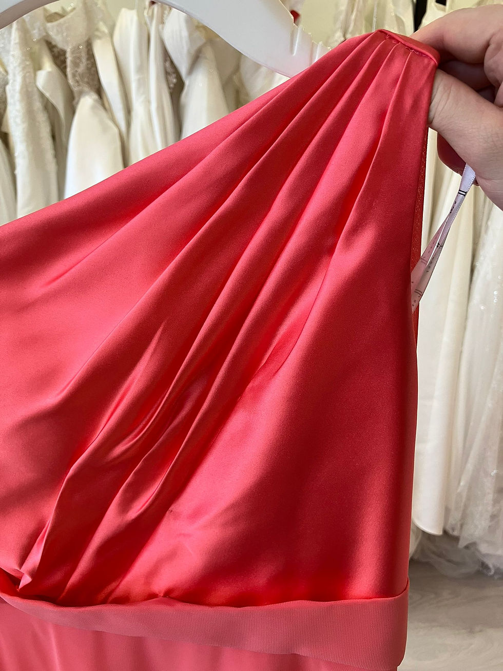 Thumbnail: Stunning coral formal child’s dress with one-shoulder pleated bodice and flowing chiffon skirt