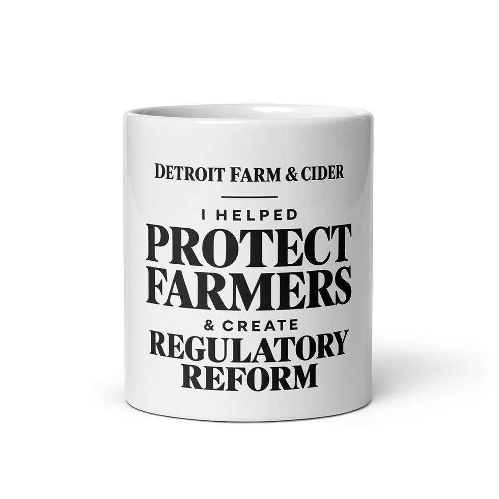 White coffee mug with charcoal campaign lettering, front view showing the complete design