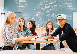 group-students-posing-table_1200w_200kb.jpg