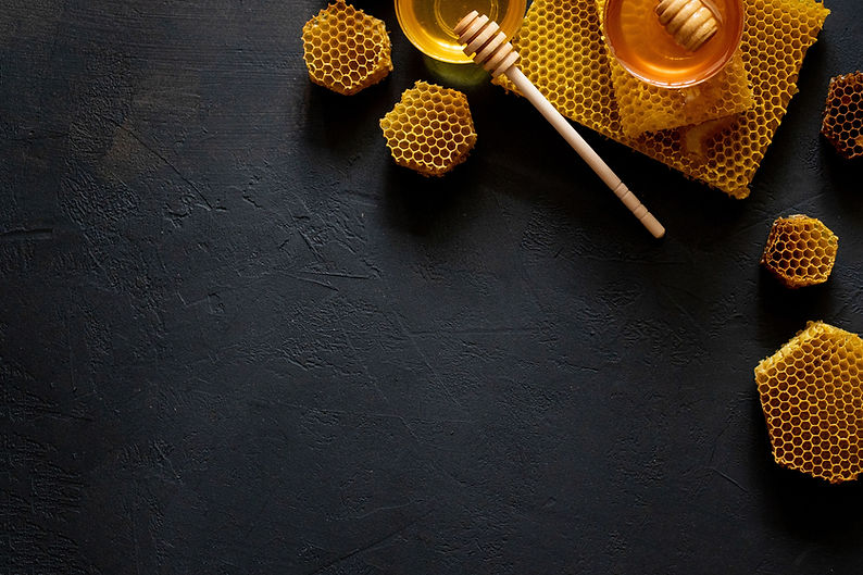 Jar of honey with honeycomb on black table, top view. space for text..jpg