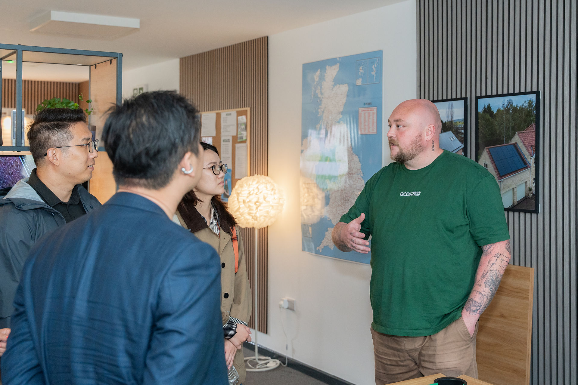 Co-Founder Kyle Morton speaking with the LONGi Solar team