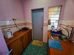 kitchen area ( induction cooker,thermo pot,single door fridge and washing facilities )