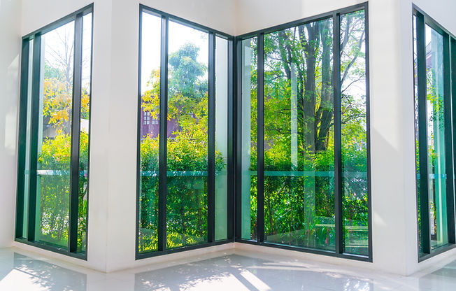 glass-window-overlooking-green-garden.jp
