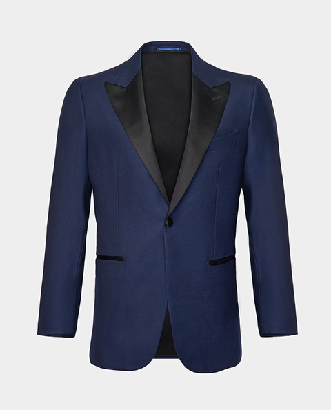 A navy twill tuxedo jacket with peak black satin lapels ghost shot on a light grey background.