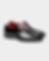 Black patent leather cap-toe oxford dress shoes with vibrant red laces and a red interior lining (front angled shot)