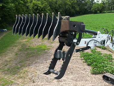 Root rake attached to Excavator
