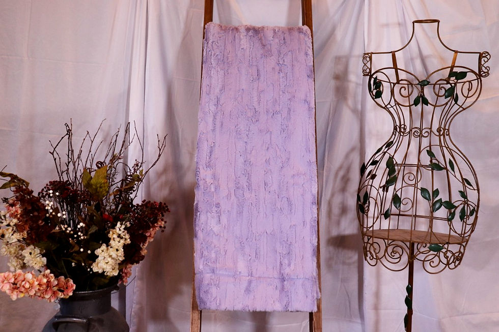 Lavender Luxe Cuddle Willow minky blanket draped over a wooden ladder in a cozy studio setting