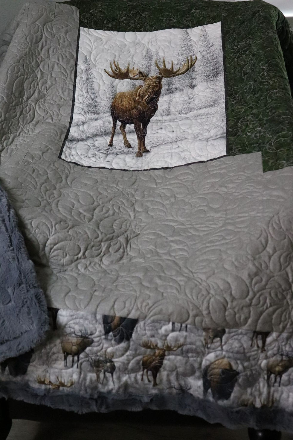 Lazy Daisy quilt with majestic moose in snowy forest and swirling textures