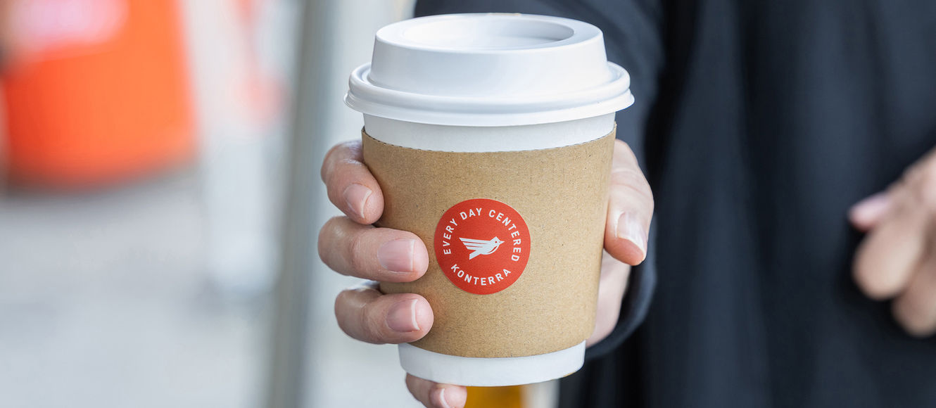 Attendee with branded beverage