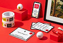An array of designed collateral from the Super 7 Art event, displayed on a red background