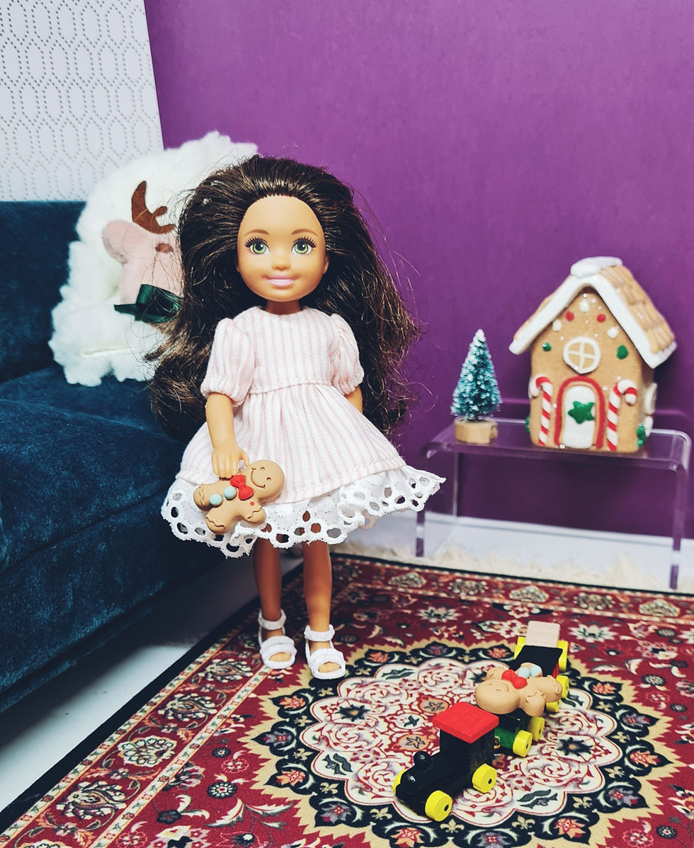 Thumbnail: Chelsea doll modelling the light pink stripe Sweet Traditional Dress