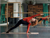 Woman practising Revolved Side Angle Pose