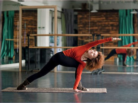 Woman practising Revolved Side Angle Pose