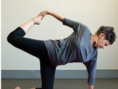 Woman practises balance and core strength.