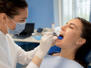 Dentist fitting custom mouthguard