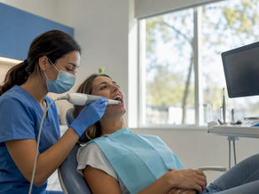Dental patient receiving intraoral scan in clinic