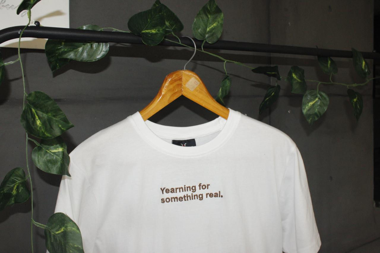 T-shirt "Yearning for something real."
