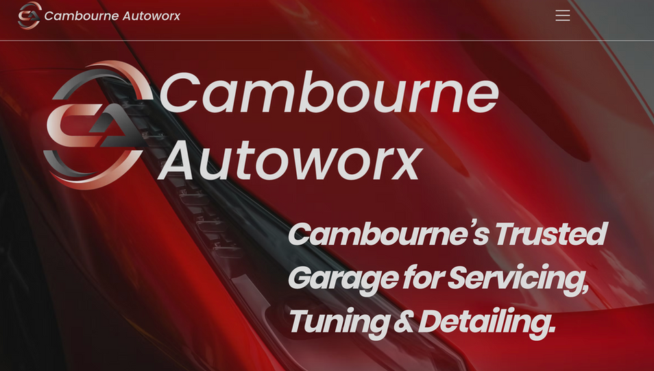 Cambourne Autoworx website homepage with bold red automotive branding and service messaging