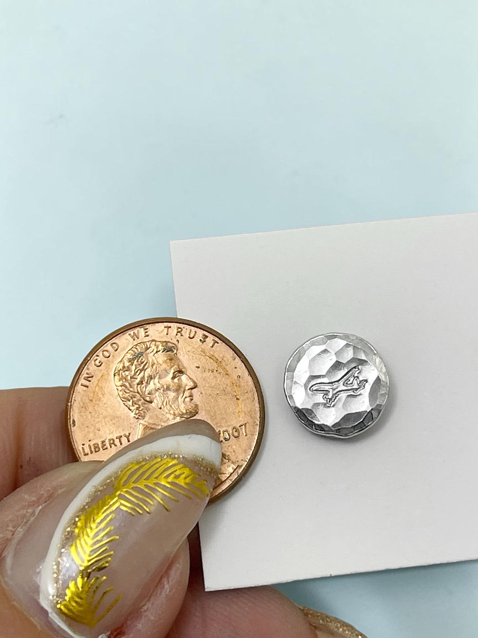 Thumbnail: Mini Hammered Airplane Disc Pendant Necklace with penny for size reference