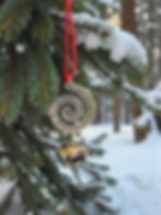 hand stamped spiral ornament every time a bell rings with red velvet ribbon hanging on tree
