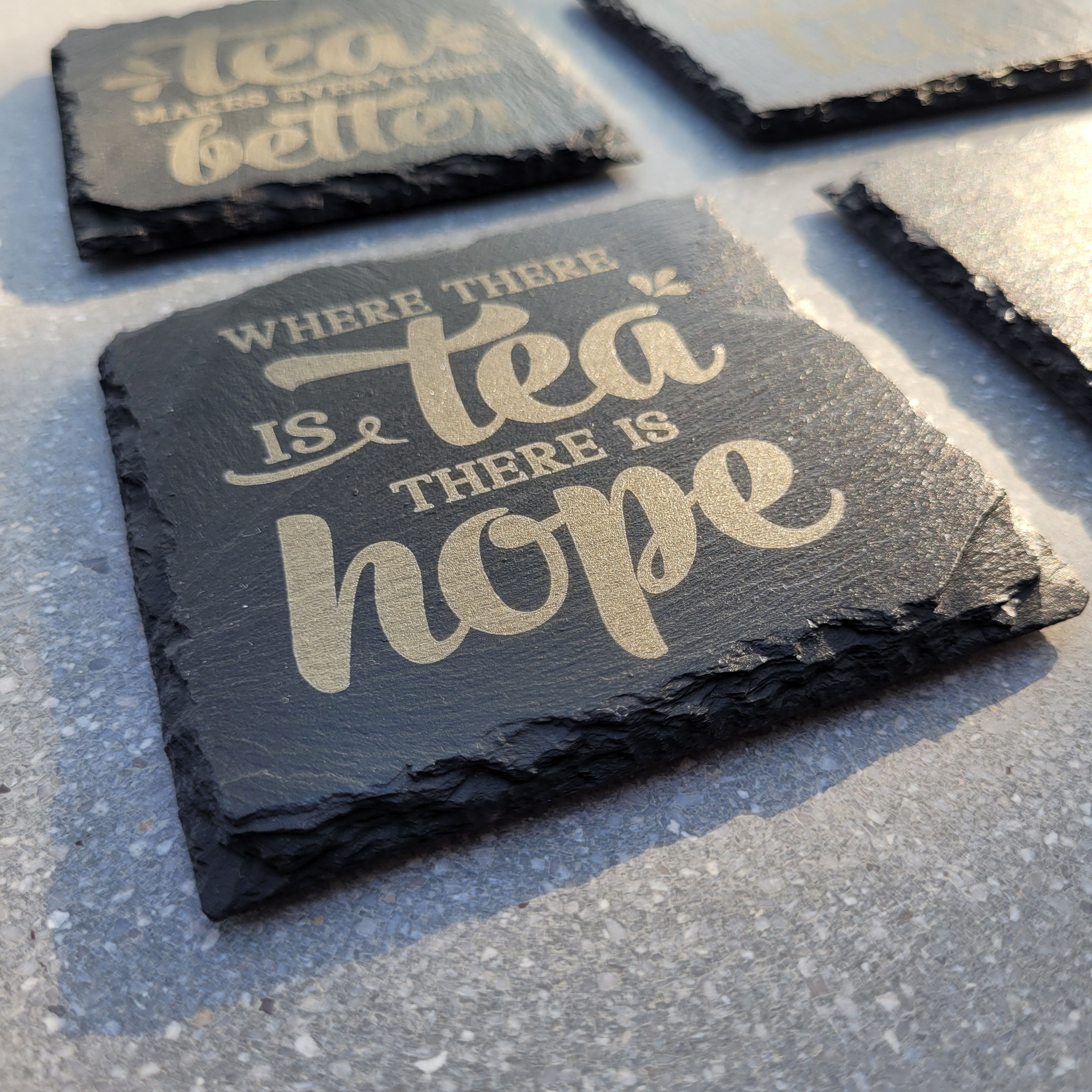 Detail of Laser engraved coaster with Tea theme caption