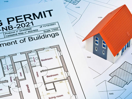 Permit for building and construction. Model house over permit paper.